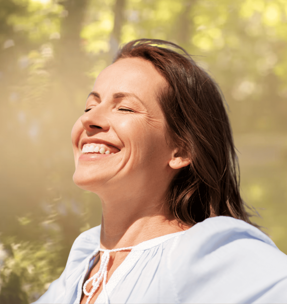 vitamin D for women over 50: Woman enjoying sunlight outdoors, symbolizing natural vitamin D support for women over 50.