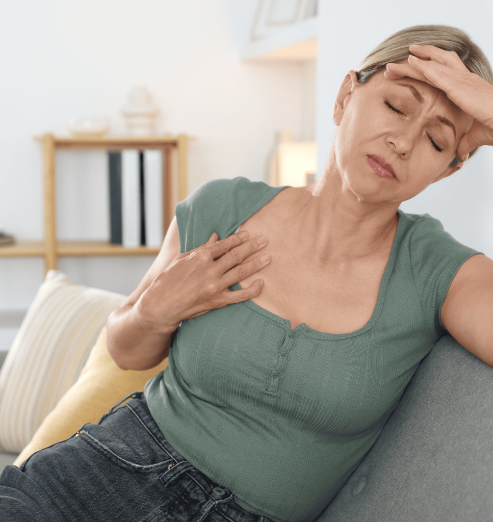 A woman experiencing hot flashes, decreased energy, and a loss of enthusiasm