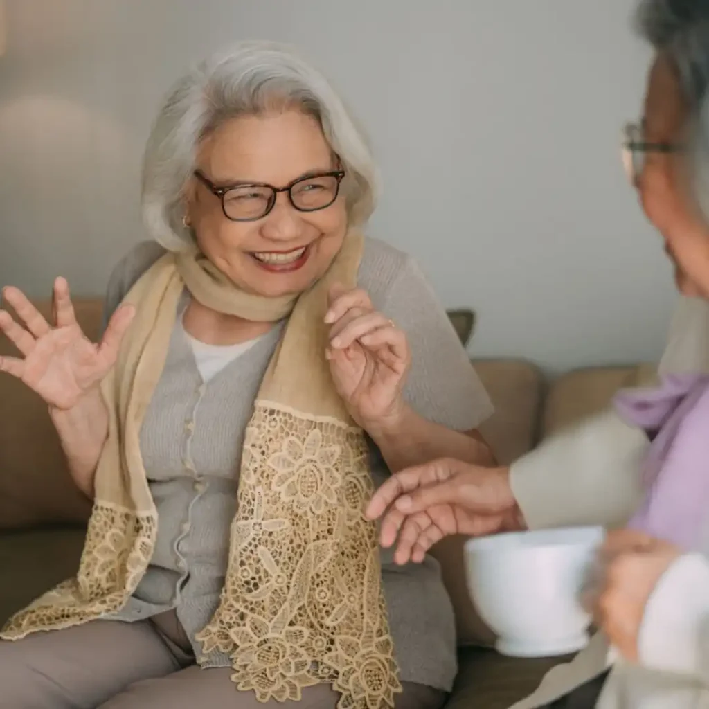 Two women over 50 having authentic vulnerable conversation while making friends