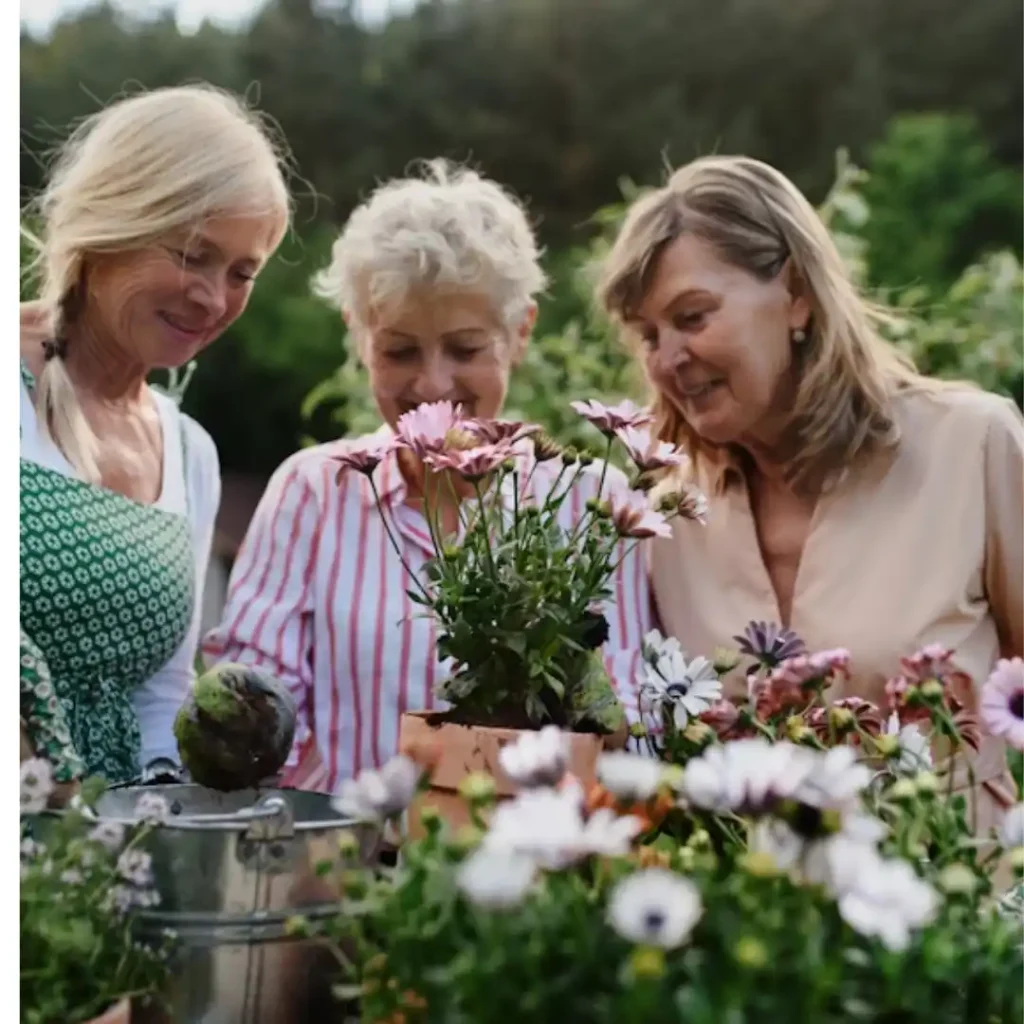 Diverse group of women over 50 engaged in a purposeful community activity, reflecting a growth mindset and mutual support.