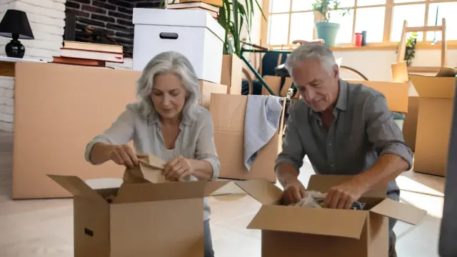 decluttering with a resistant partner mature couple teamwork