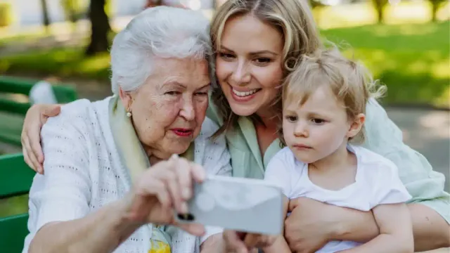Four generations from grandma to great grandma celebrating family continuity and longevity