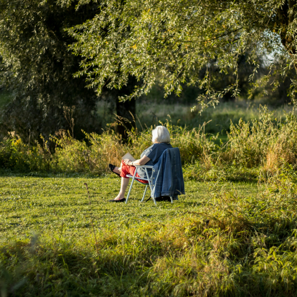 Grandmother enjoying peaceful alone time practicing self-care while maintaining her individual personality and wellness