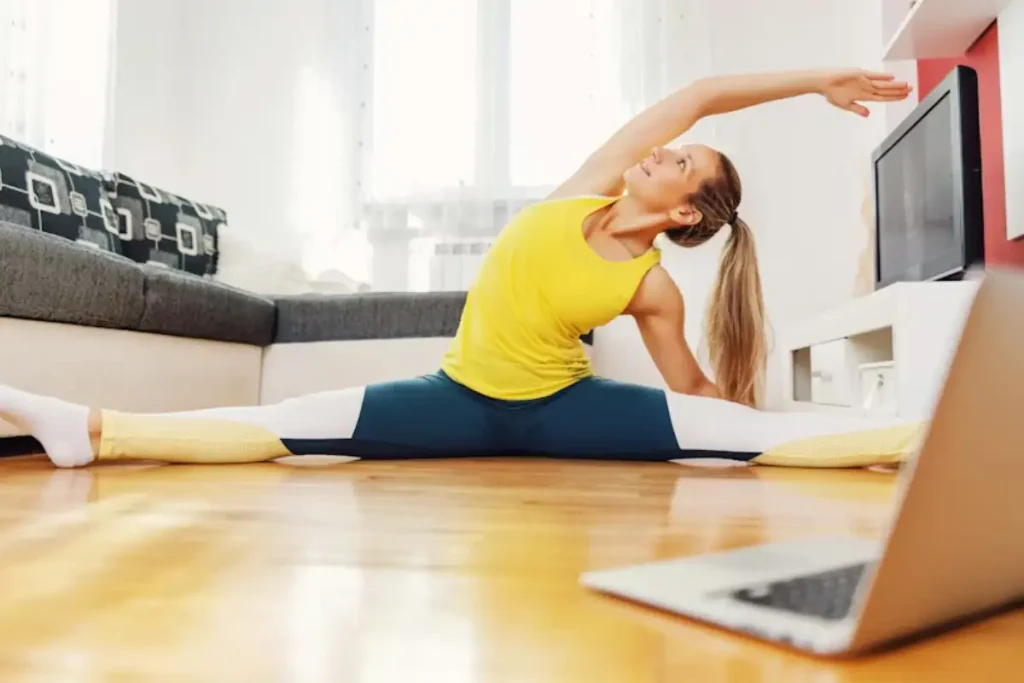 Strength training for women after 50 woman in her 50s doing a squat at home to build strength and confidence.