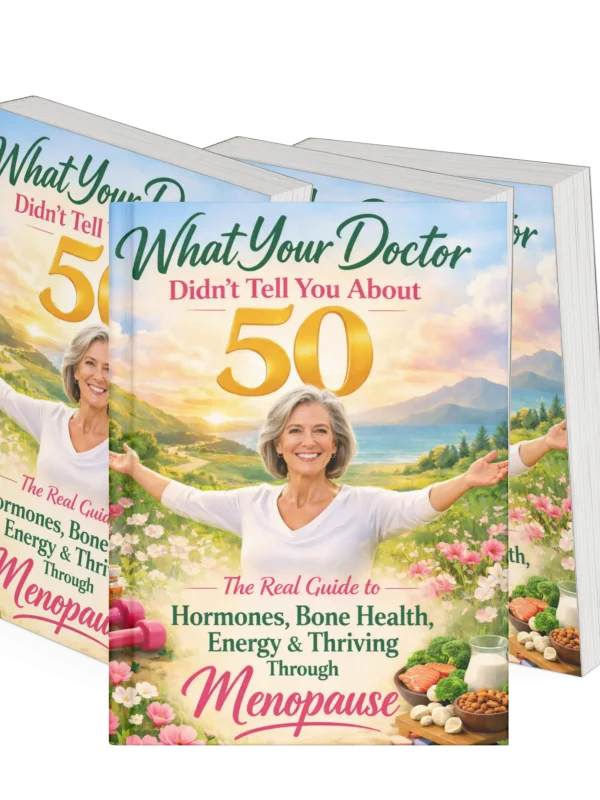 Multiple copies of the book "What Your Doctor Didn’t Tell You About 50" displayed together, featuring a woman over 50 and topics including menopause, hormones, bone health, energy, and healthy aging.